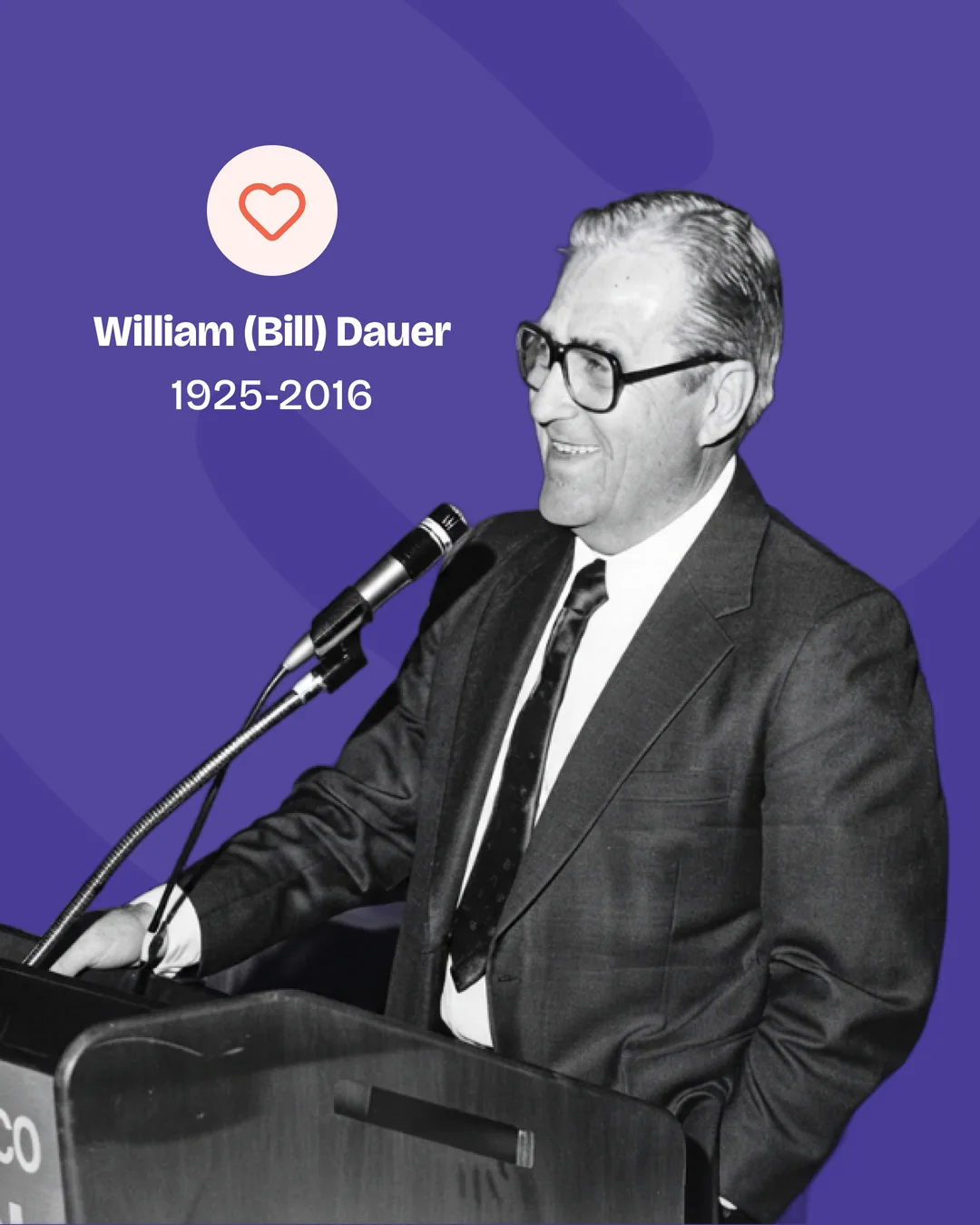 Black and white photo of William (Bill) Dauer, 1925 to 2016, speaking at a podium.